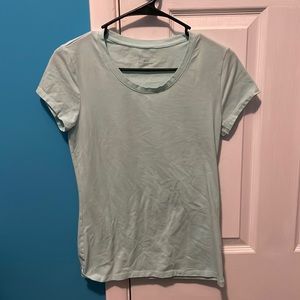 Plain turquoise/very light green t-shirt.